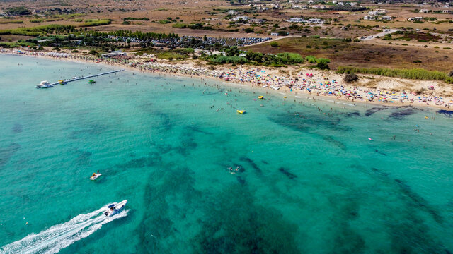 Aerial view of the Pescoluse Beach, aka Maldives of Salento, in the south of Italy - Apulian beach with turquoise waters in summer - Idyllic holiday destination along the Ionian Sea