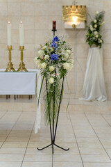 flower arrangements in the church at a wedding