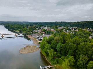 Fototapeta na wymiar The view of aerial Delaware river, bridge across the in the historic city New Hope Pennsylvania and Lambertville New Jersey US