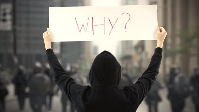 WHY question on a protest banner