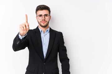 Young caucasian business man posing in a white background isolated Young caucasian business man showing number one with finger.