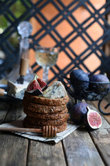 fig with Camembert cheese and honey.   Wine and cheese still life.