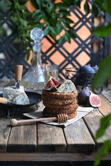 fig with Camembert cheese and honey.   Wine and cheese still life.