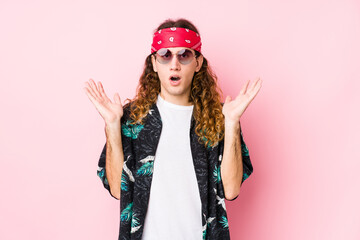 Young hippie caucasian man isolated surprised and shocked.