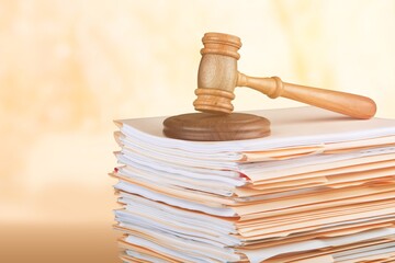 Judge wooden hammer and stack documents