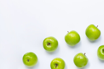 Green apples on white background. Copy space