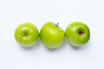 Green apples on white background. Copy space