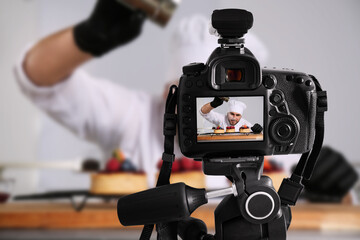 Food photography. Shooting of chef decorating desserts, focus on camera
