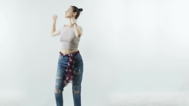 Girl dancing on white background