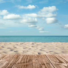 Wooden surface on sandy beach near ocean