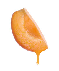 Apricot oil dripping from fresh cut fruit on white background