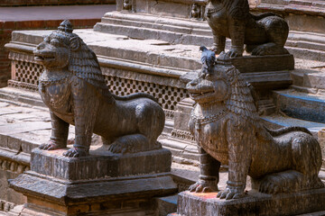 Fototapeta na wymiar The statue of lion at the entrance of Krishna Mandir(Krishna Template) at Patan Durbar Square, Patan