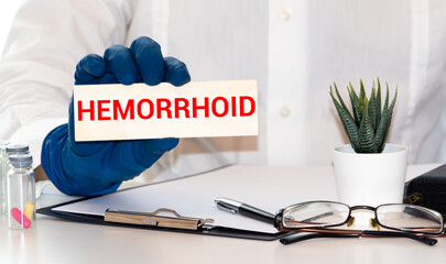 Stethoscope on note book with hemorrhoid words as medical concept