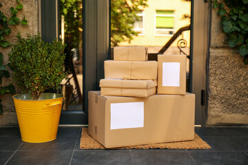 Delivered parcels on door mat near entrance