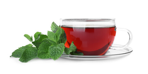 Cup with hot aromatic mint tea and fresh leaves isolated on white