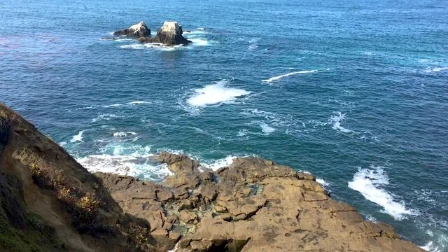 Tide Pools, Sea Waves And Rocks, With Seal Rock In The Distance And Then Panning To Rocky Beach From High Up On A Bluff At Crescent Bay Point Park In Laguna Beach, CA.