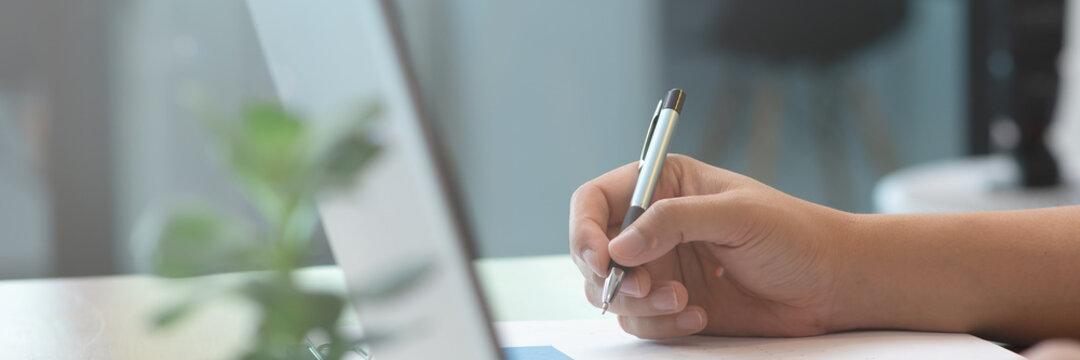 Close up hand business women note job  on graph in business meeting.