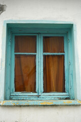 Wooden window of an old abandoned building on the island of Lesvos, Greece.