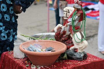 saint george offering money statue