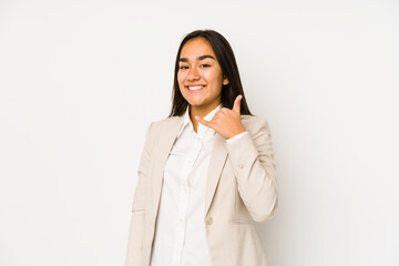 Young woman isolated on a white background showing a mobile phone call gesture with fingers.