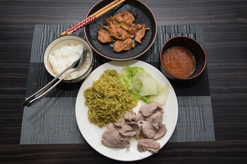 Asian oriental food composition, served on dark rustic background, top view. Thai cuisine set, japanese, chinese, korean.