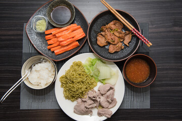 Asian oriental food composition, served on dark rustic background, top view. Thai cuisine set, japanese, chinese, korean.