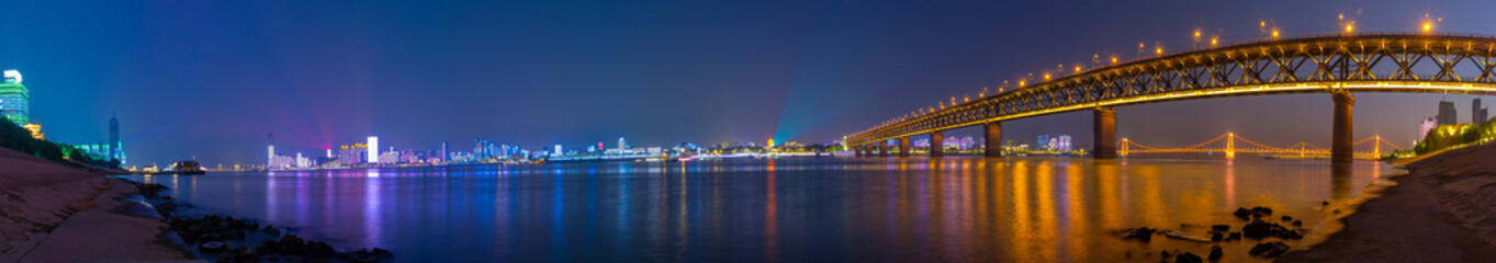 Fototapeta na wymiar Wuhan Yangtze River and city night and light show scenery