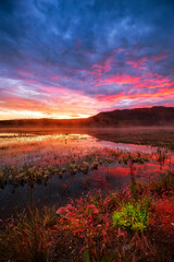 Beautiful Morning Sunrise with Dramatic Colorful Clouds. Taken at Fish Lake near Whitehorse, Yukon, Canada.