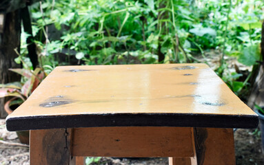 Light brown chairs stand out in front of the Sufficiency Economy Park.