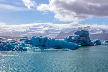 Fototapeta na wymiar Jokulsarlon Lagoon, a blue glacier lagoon at the south coast of Iceland, on summer time, at a sunny day.