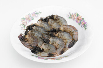 Fototapeta na wymiar Fresh shrimp on a white plate.
