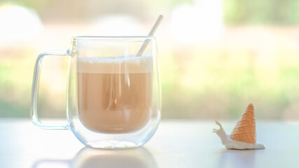 A cup of coffee latte cappuccino on the table isolated bright sunlight natural background in the morning