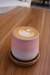 Fototapeta na wymiar cup of coffe on wooden background
