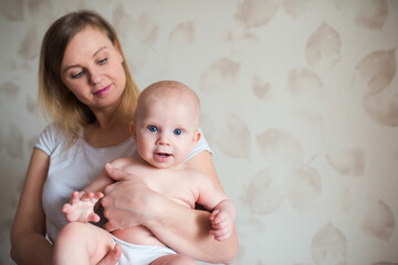 happy mother with baby, lifestyle portrait at home, parenting with love and care