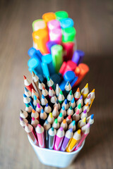 Collection of colored Pencils, pens and highligters in pen holders