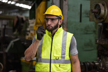 Portrait of technician man or industrial worker with hardhat or helmet, eye protective glasses,...