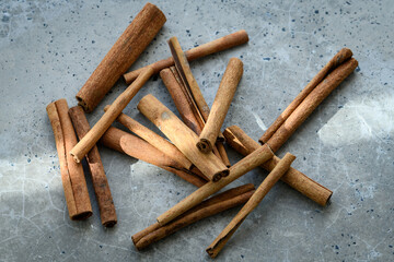 Cinnamon sticks on a concrete table