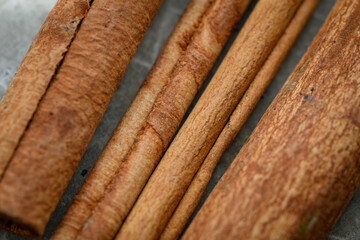Cinnamon sticks on a concrete table