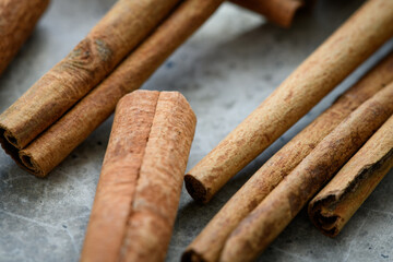 Cinnamon sticks on a concrete table