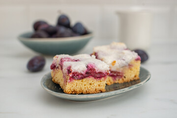 home made plum meringue pie on a plate