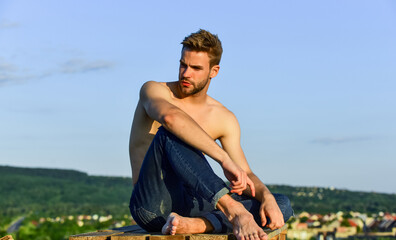 Naklejka na ściany i meble Feeling free and confident. shirtless guy relax at sunrise. young athletic guy with muscular body. sportsman and fitness model. naked strong man. muscular strong man has bristle on face