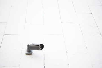 outdoor video surveillance camera on a white wall. minimalism