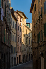 Fototapeta na wymiar Lonely street at the old town of Siena, Tuscany Region in Italy 