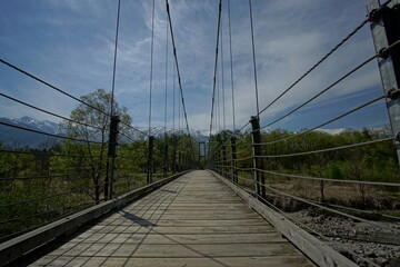Fototapeta na wymiar Beautiful landscape and suspension bridge in Northern Alps of Japan, Hakuba.