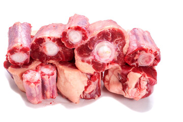 Pile of fresh raw ox tail portion on white background. Meat industry concept