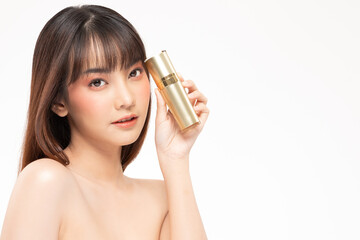 Beauty asian woman hold bottle cosmetic cream lotion  and cheerful.