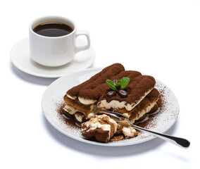 portion of Classic tiramisu dessert and cup of fresh espresso coffee isolated on white background with clipping path
