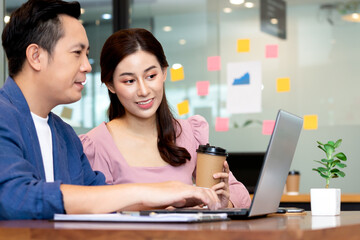 Asian business man and women meeting and talk about job in office.