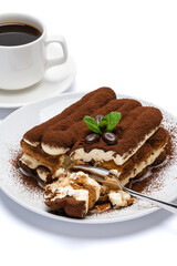 portion of Classic tiramisu dessert and cup of fresh espresso coffee isolated on white background with clipping path