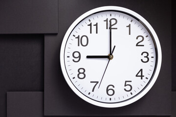 wall clock at black abstract background